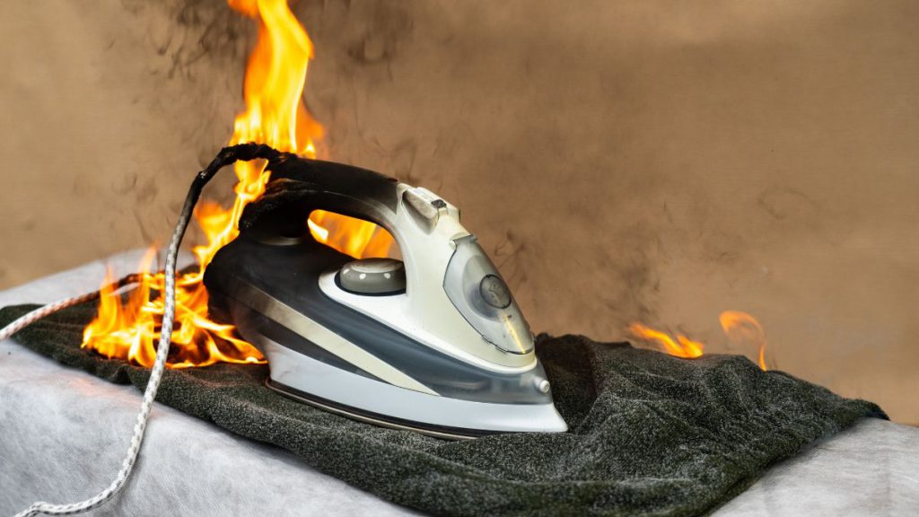 Domestic accident-image of an electric iron on fire